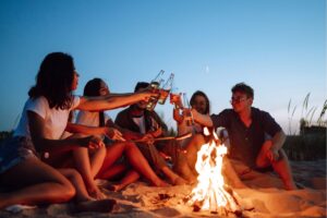 Ibiza locals and tourists gathering on the beach for San Juan at sunset