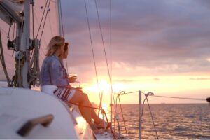 Tourists relaxing on a catamaran during a sunset cruise in Ibiza

