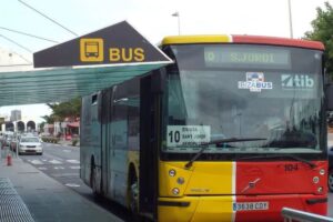  Main Ibiza public bus station with travelers boarding a local bus