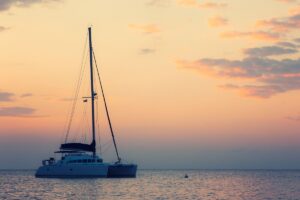  Sunset catamaran cruise along Ibiza’s coastline in July