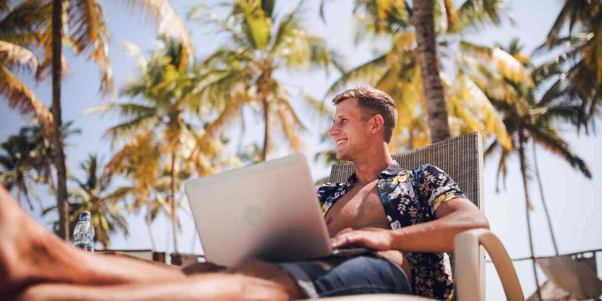 Digital nomad working remotely by the Ibiza coastline