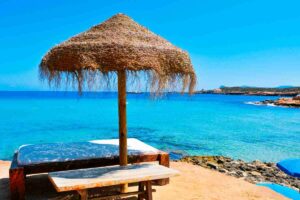 Lively beach club in Playa d’en Bossa, Ibiza with summer crowds