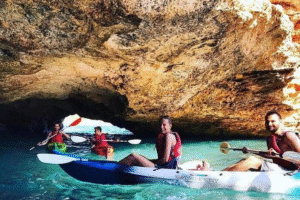 Adventure travelers kayaking along the coast of Sant Antoni, Ibiza