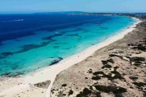 Turquoise waters and white sand at Ses Illetes beach in Formentera