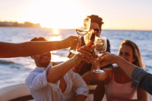 Small group enjoying a sunset boat cruise off the coast of Sant Antoni Ibiza