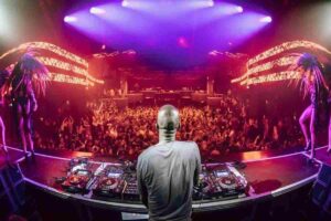 World-renowned DJ performing under LED lights at Hï Ibiza Theatre