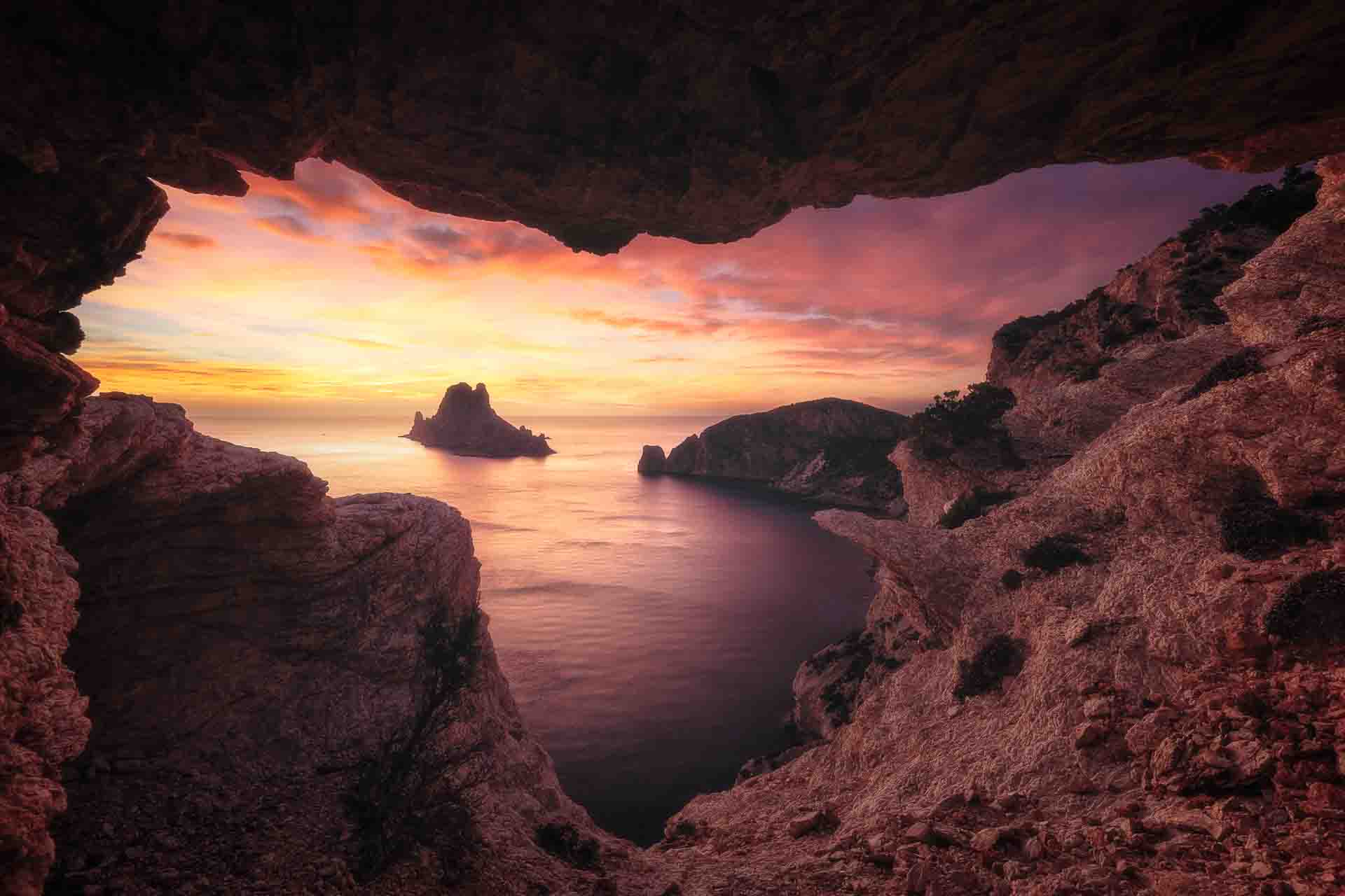 Cave entrance along Es Vedrà hiking path in Ibiza
